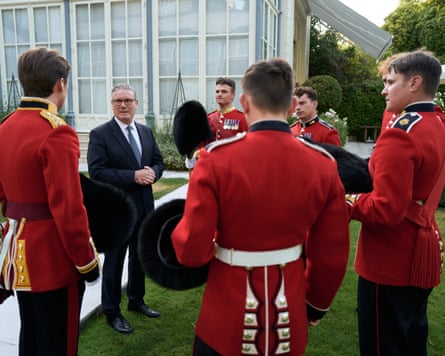 Keir Starmer meets members of the Grenadier guards before the Bastille Day parade in Paris.Photograph: Pierre Crom/AFP/Getty Images