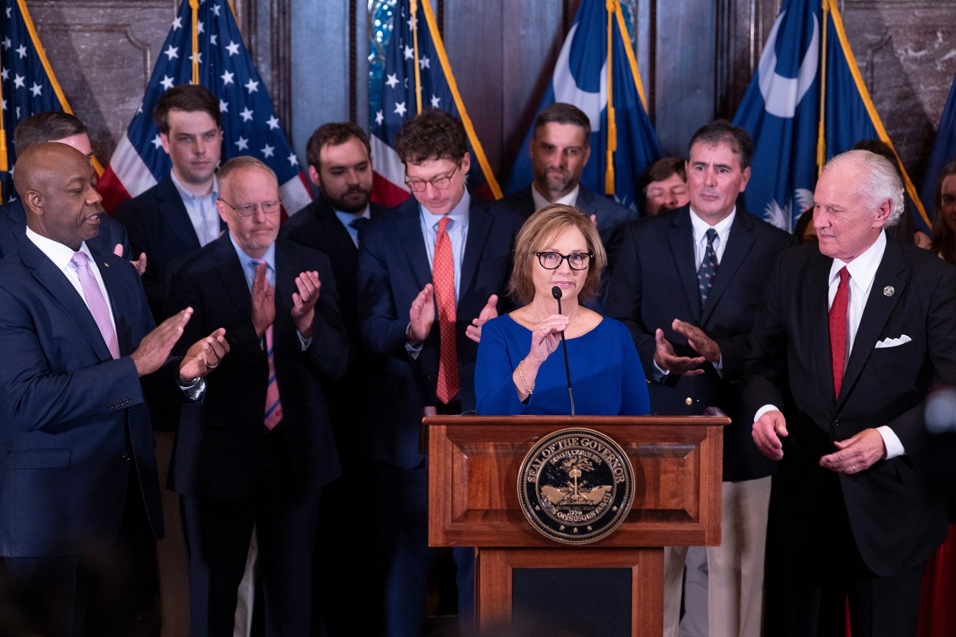 Darline Graham Nordone speaks next to South Carolina Gov. Henry McMaster and Sen. Tim Scott after being appointed to fill the vacancy created by the passing of her brother, Sen. Lindsey Graham, July 13, 2026, in Columbia, S.C.Sean Rayford/AP Photo