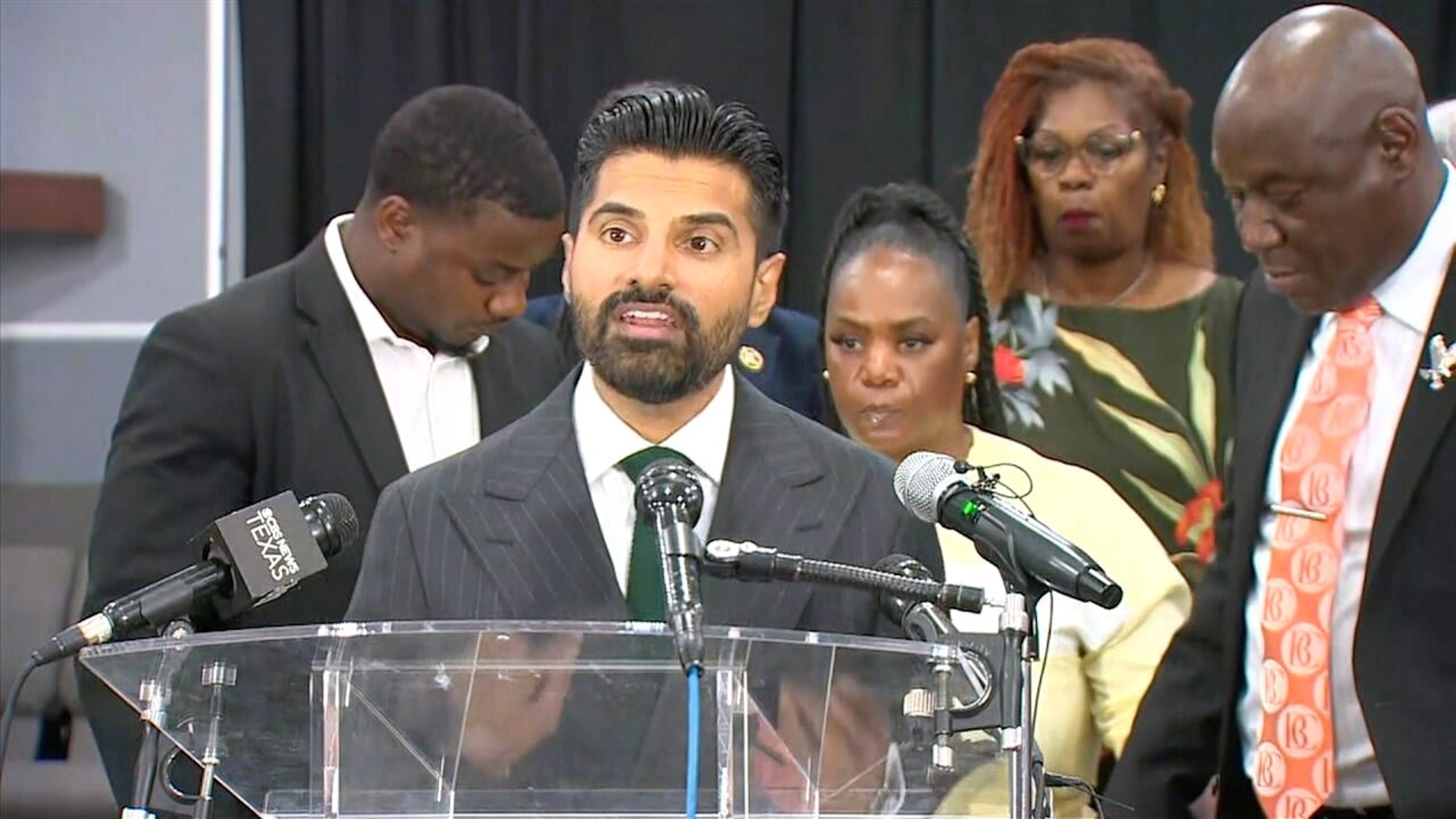 Attorney Sean Deredia, with family and legal team of Daniel Erving, speaks at a press conference on July 14, 2026.WFAA