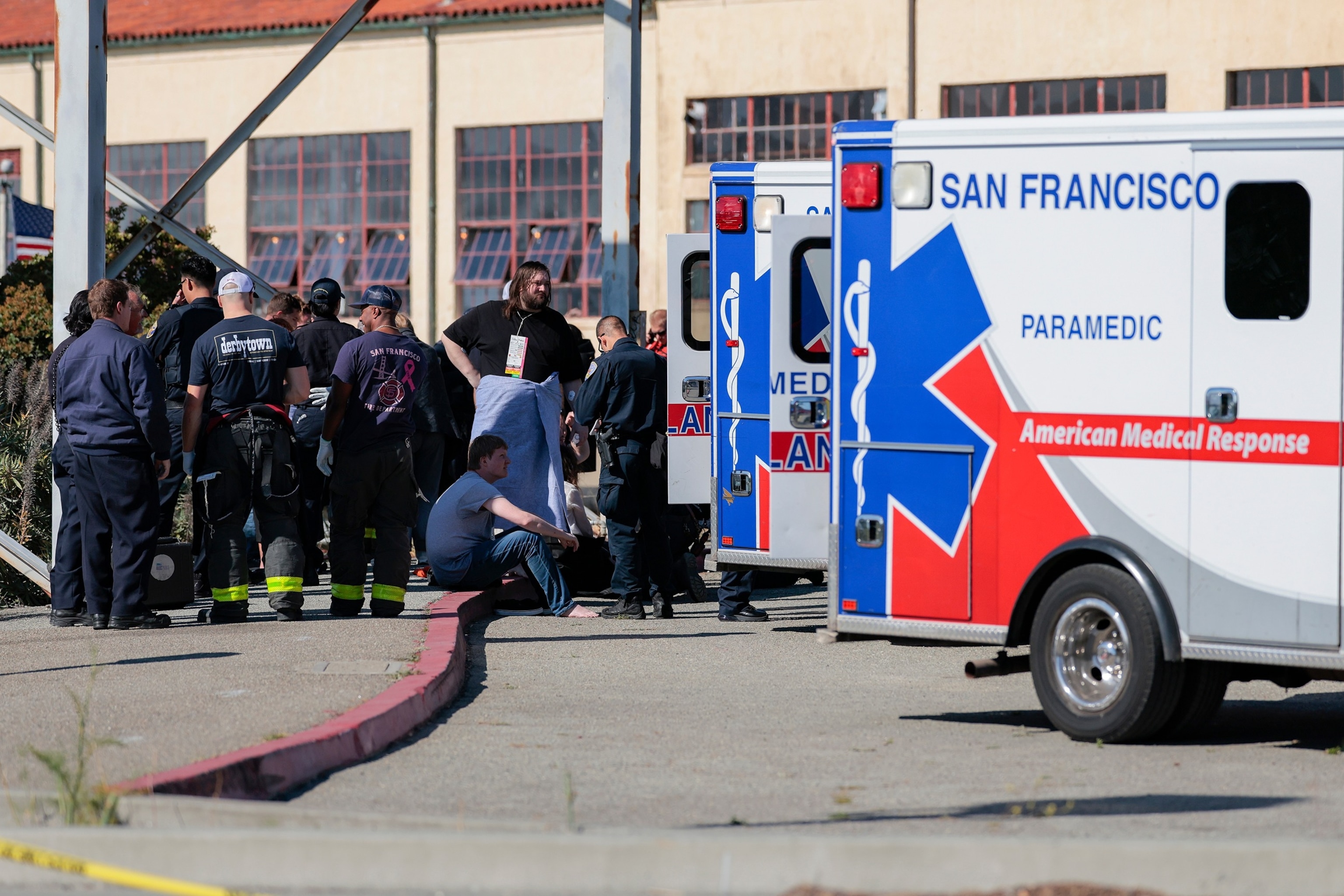 Passengers who were injured during a boat incident are treated by emergency services at Gashouse Cove on July 14, 2026 in San Francisco, California. A rescue mission continues after 16 people were rescued and two remain missing. One death has been reported.Heather Diehl/Getty Images