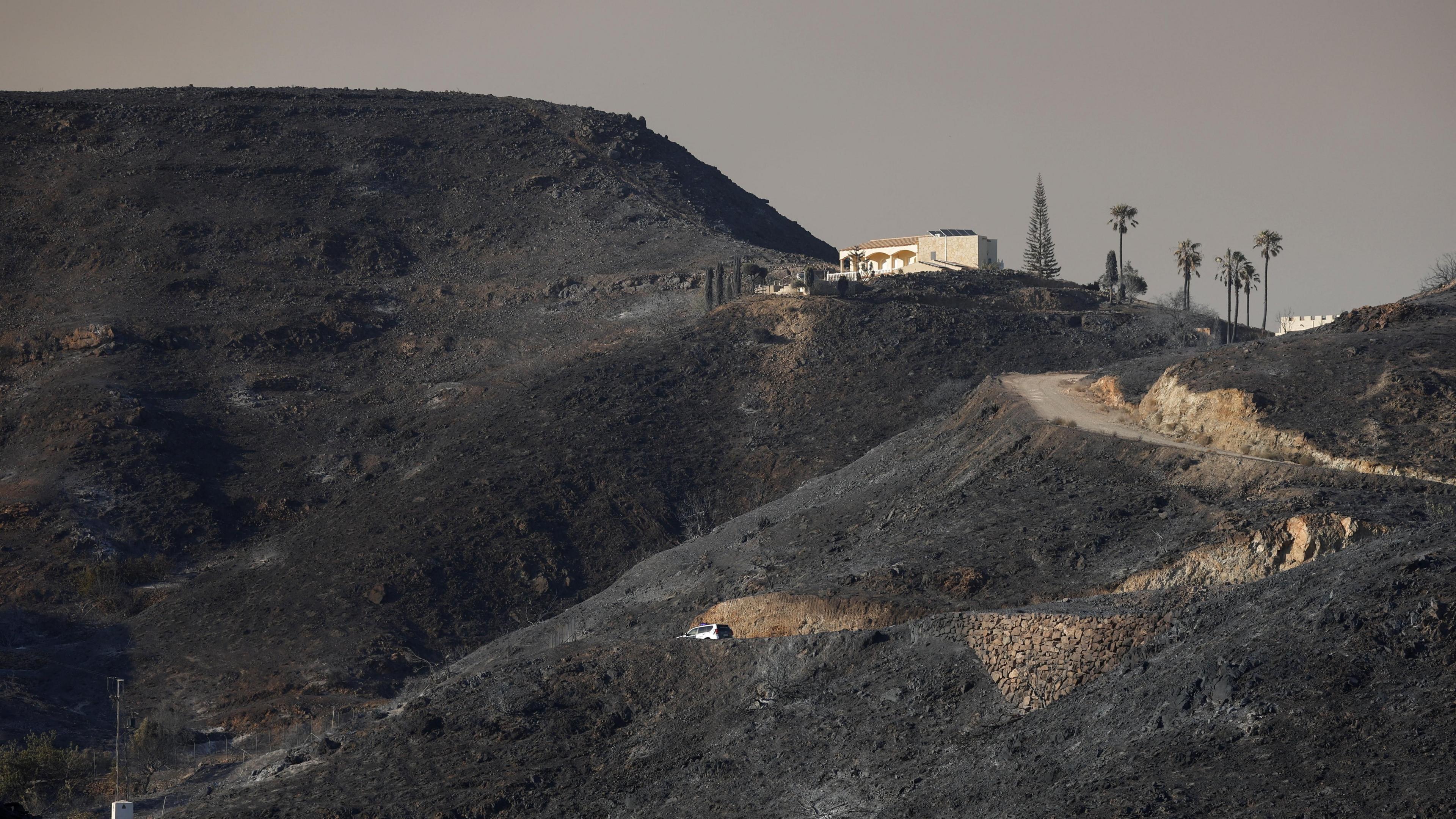 Image caption,The wildfires left patches of charred land across Almería province