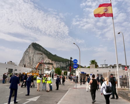 People walk across the border between Spain and Gibraltar in La Línea de la Concepción on Wednesday as the iron border gates are removed.Photograph: Roman Rios/EPA