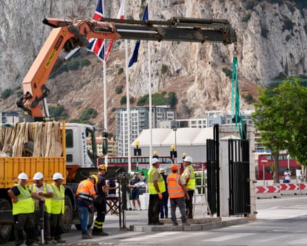 Workers with a crane remove the iron gates of the border at La Línea de la Concepción on Wednesday.Photograph: Roman Rios/EPA