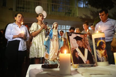 Friends and relatives in Colombia hold a vigil for Joan Sebastián Durán Guerrero, a Colombian national who was fatally shot by an Immigration and Customs Enforcement officer in Maine.Photograph: Jaime Moreno/AP