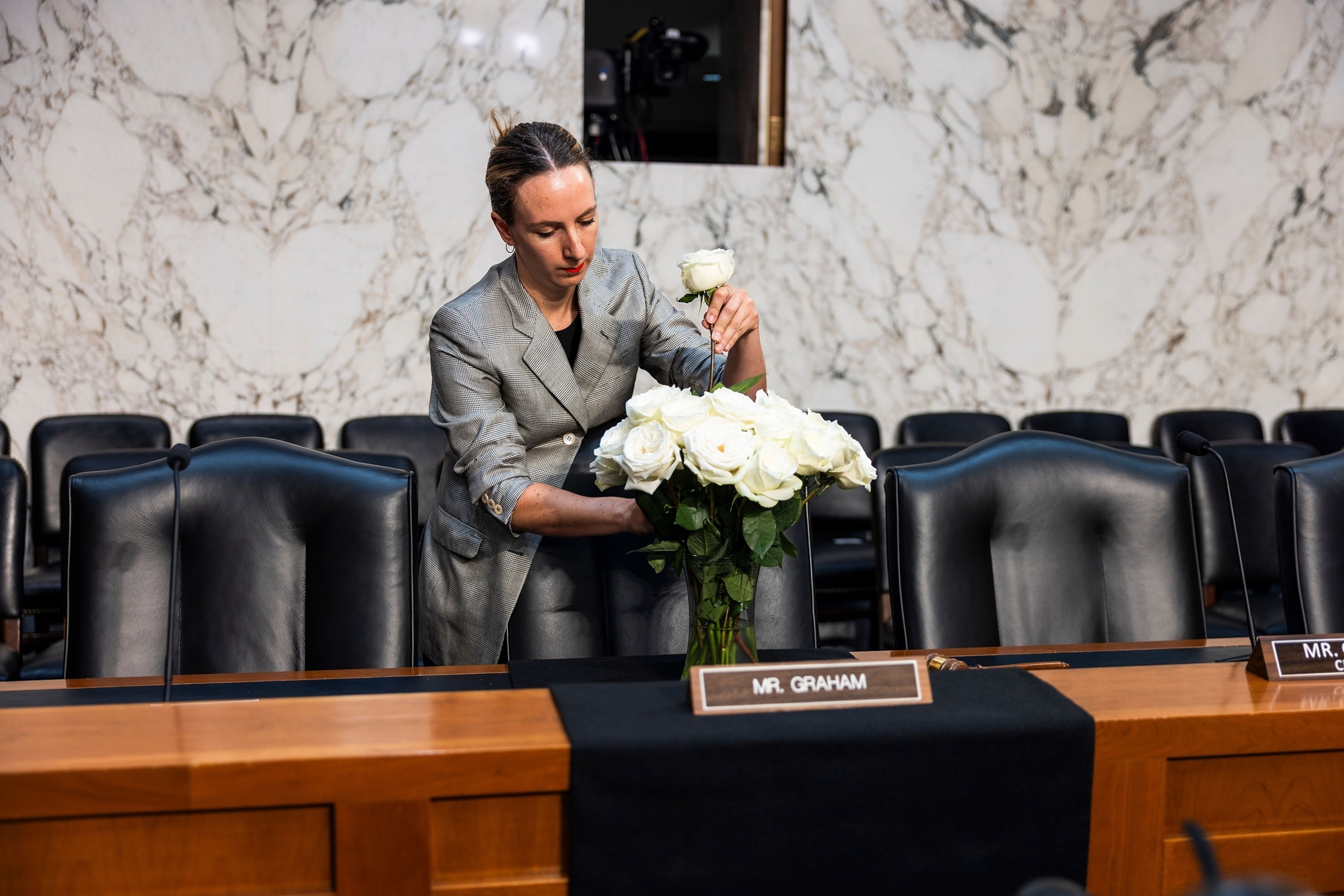 A Senate staffer puts flowers on the desk of former Sen. Lindsey Graham ahead of Acting Attorney General Todd Blanche's confirmation hearing before the Senate Judiciary Committee in Washington July 15, 2026.Jim Lo Scalzo/EPA/Shutterstock