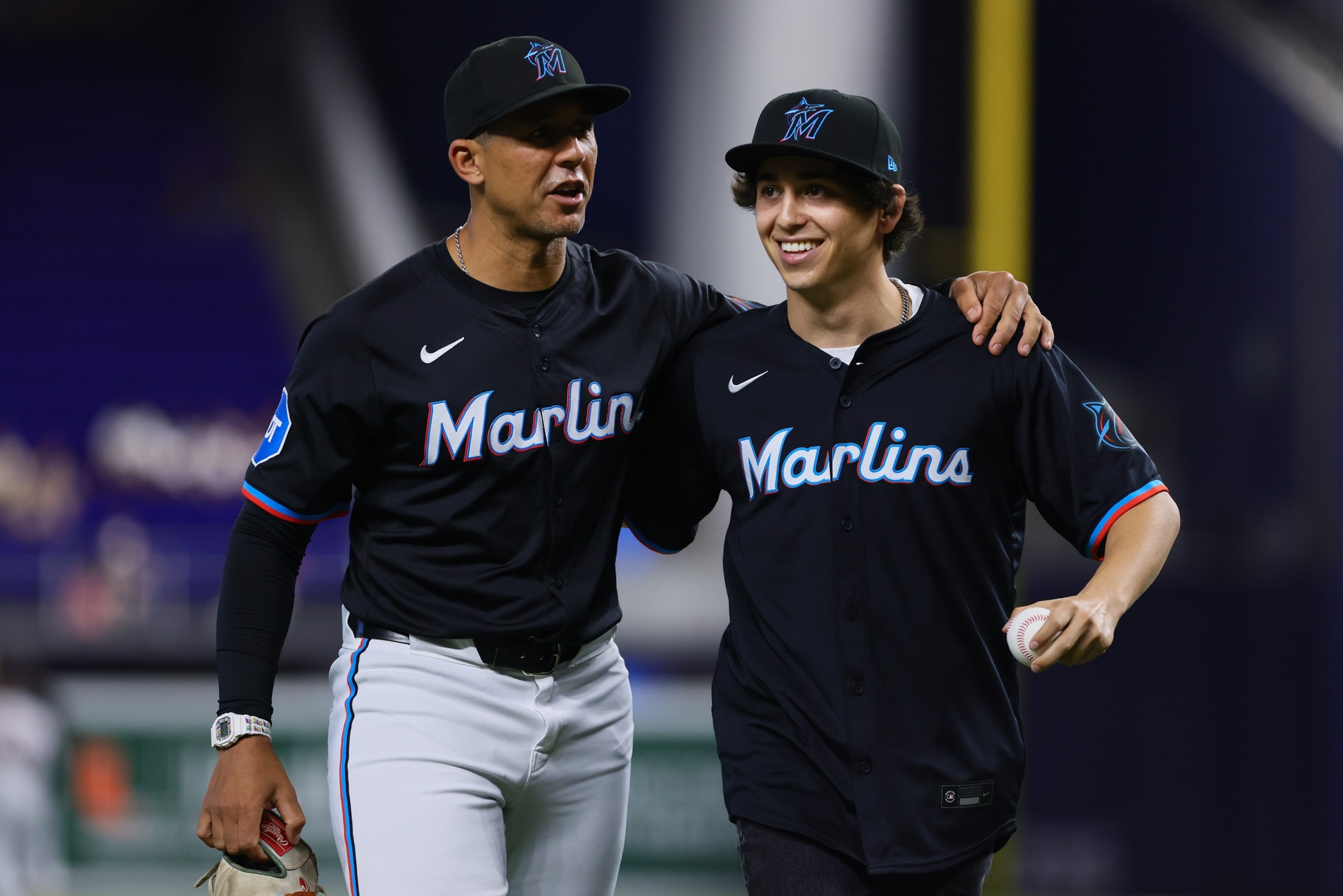 Marcello Hernandez talks to Jon Jay #11 of the Miami Marlins after throwing the ceremonial first pitch at loanDepot park, June 7, 2024, in Miami.Sam Navarro/Getty Images