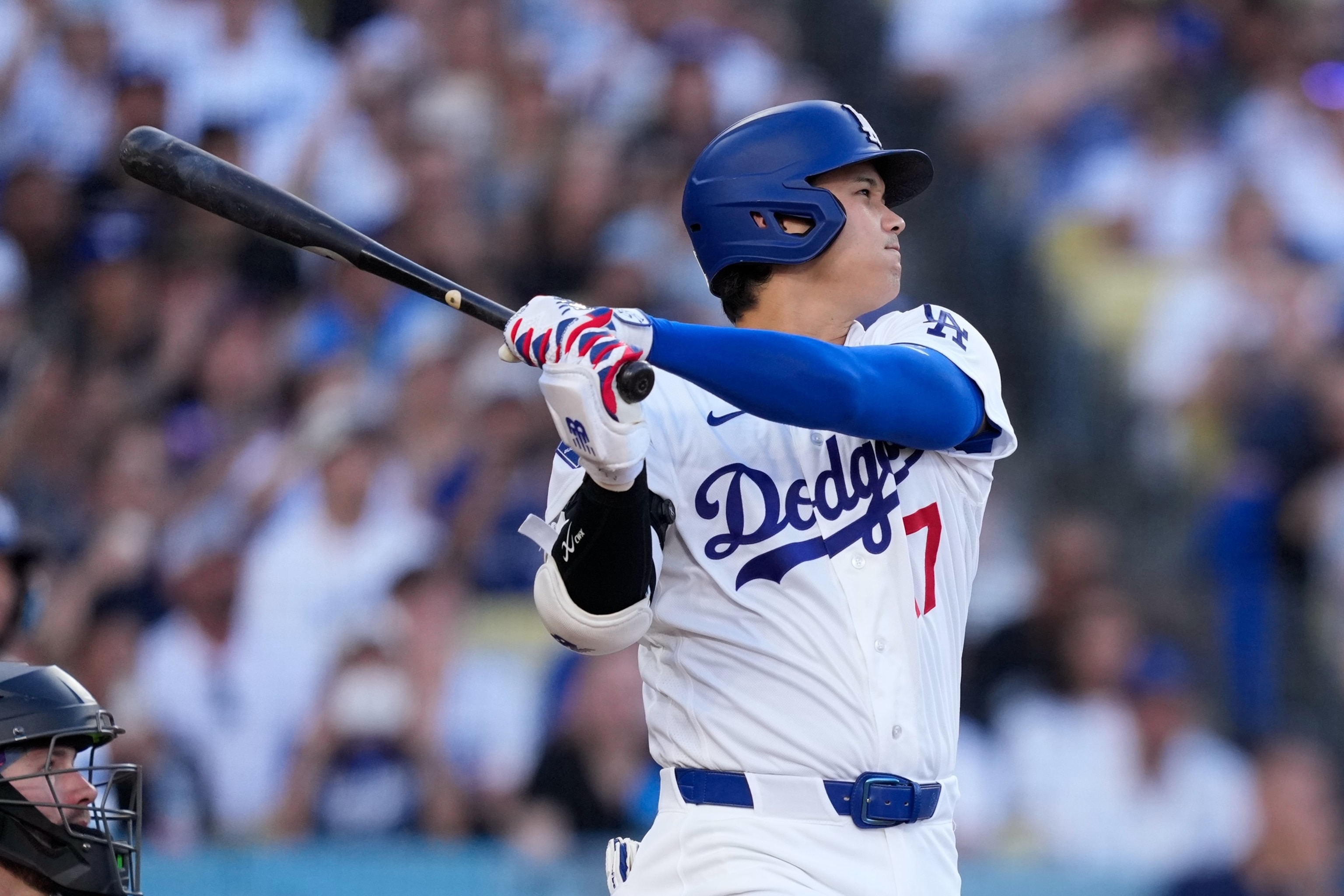 Los Angeles Dodgers' Shohei Ohtani hits a solo home run during the first inning of a baseball game against the Colorado Rockies, July 7, 2026, in Los Angeles.Mark J. Terrill/AP