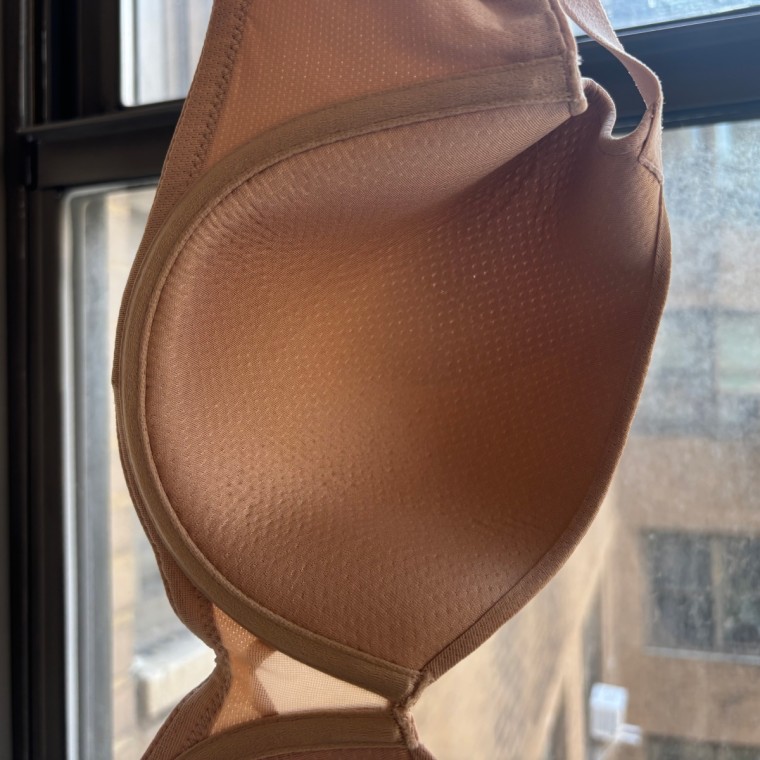When I hold the bra up to the light, I can see light passing through the perforated cups similar to how air does while I’m wearing it to keep me cool and dry.Courtesy Zoe Malin