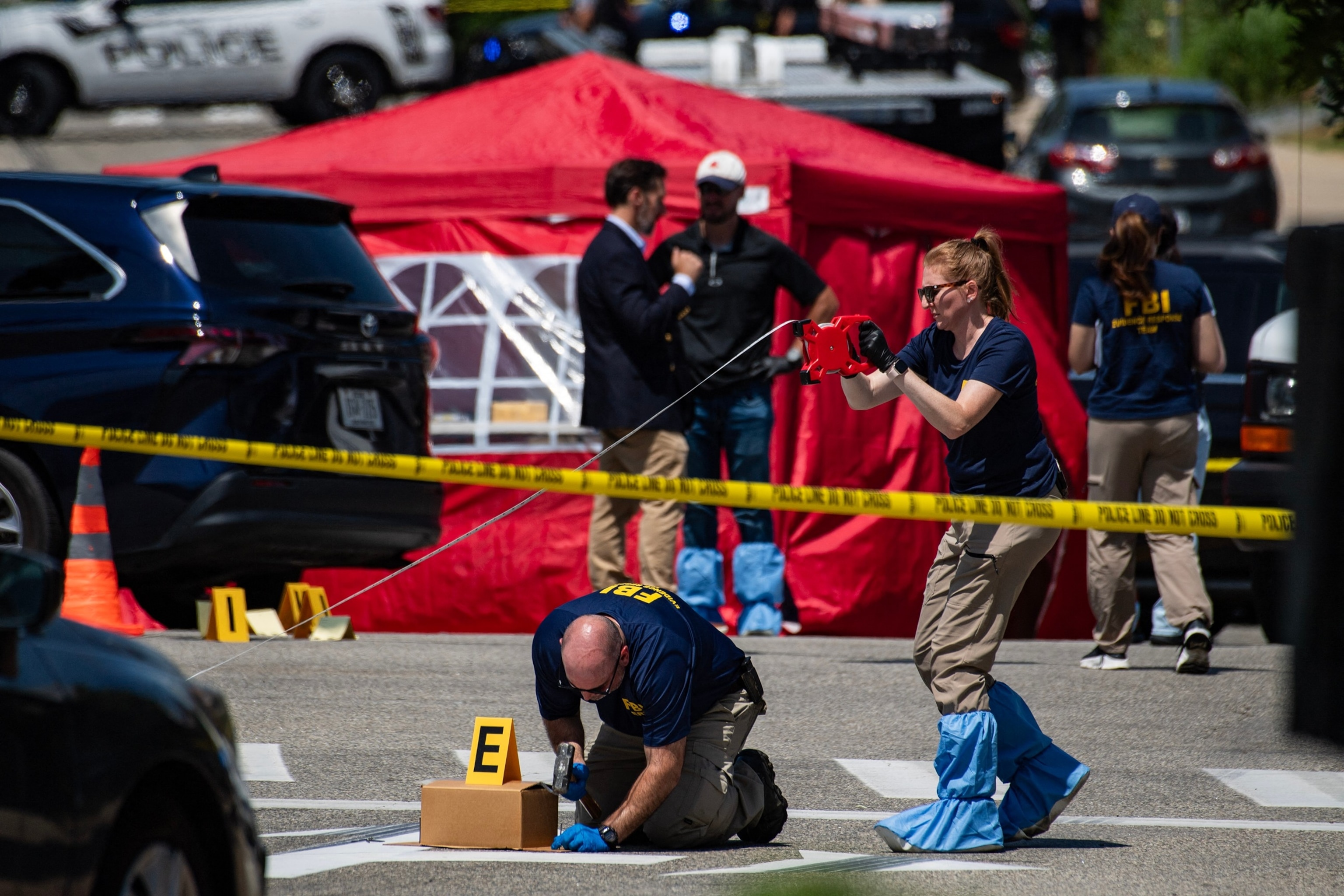 FBI agents work at a scene of a shooting involving U.S. Immigration and Customs Enforcement in Biddeford, Maine, July 13, 2026.Joseph Prezioso/AFP via Getty Images