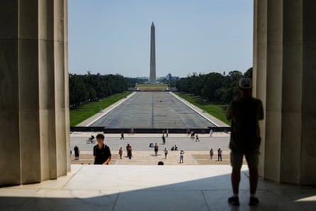 Pedestrians walk near the drained Lincoln Memorial Reflecting Pool, after renovations and Independence Day celebrations.Photograph: Al Drago/Reuters