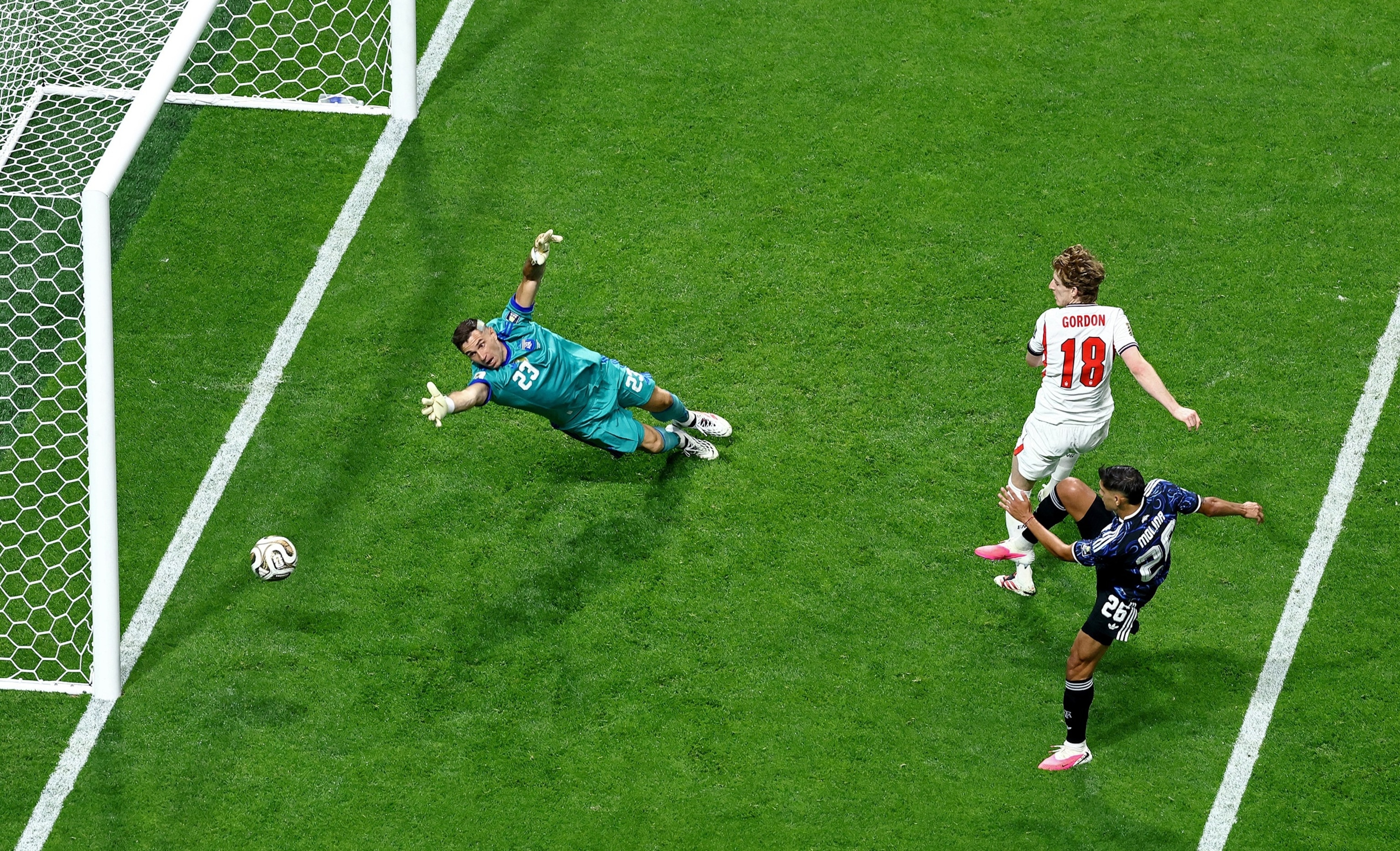 England's Anthony Gordon scores their first goal past Argentina's goalkeeper Emiliano Martinez during their FIFA World Cup 2026 semi-final match in Atlanta, July 15, 2026.Lee Smith/Reuters