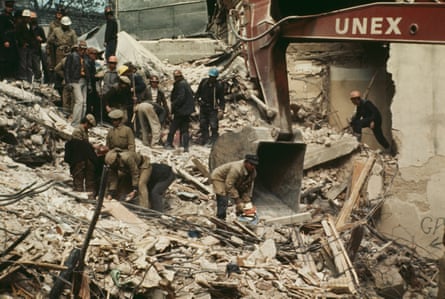Rescue workers sifting through rubble in Bucharest in 1977 after a powerful earthquake in the Balkan region.Photograph: Bettmann Archive/Getty Images