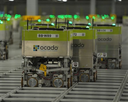 Picking machines at Ocado’s distribution warehouse in Luton, Bedfordshire.Photograph: Jonathan Brady/PA