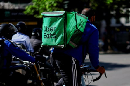 The deal will combine Uber Eats with Delivery Hero’s brands across 99 countries.Photograph: Sarah Meyssonnier/Reuters
