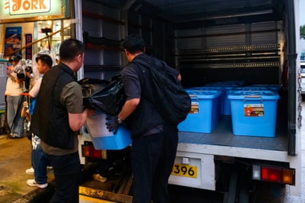 Police officers load confiscated items from independent bookstore Have a Nice Stay.Photograph: Tommy Wang/AFP/Getty Images