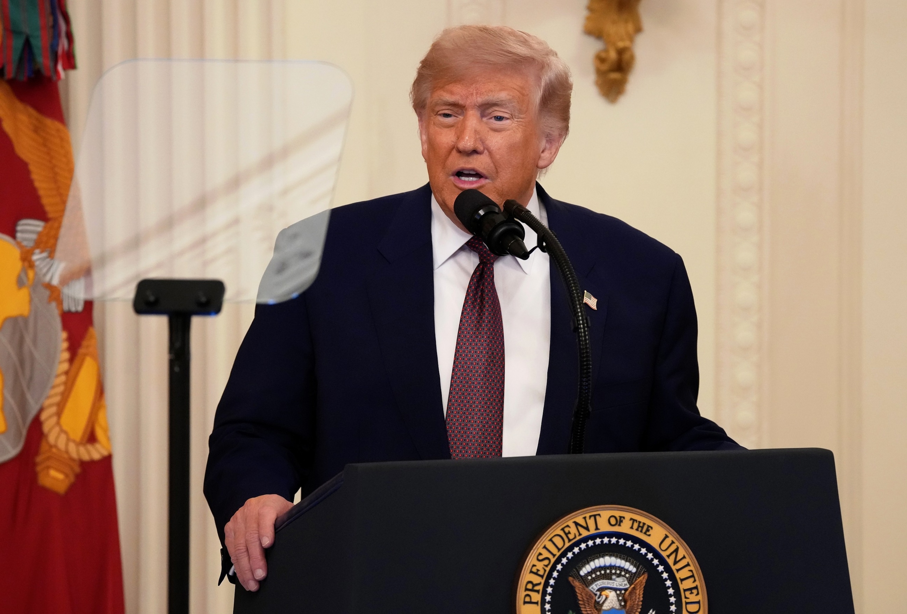 Gabriel Perez cleans the teleprompter before President Donald Trump speaks at the Future Investment Initiative Institute's summit, March 27, 2026, in Miami Beach, Fla.Mark Schiefelbein/AP