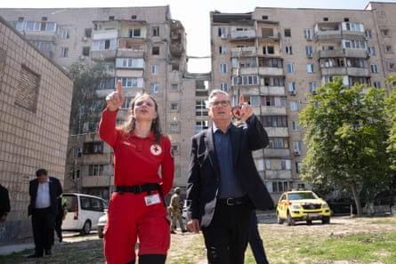 An emergency worker shows Starmer the damage left by Russian airstrikes on Kyiv.Photograph: Stefan Rousseau/PA