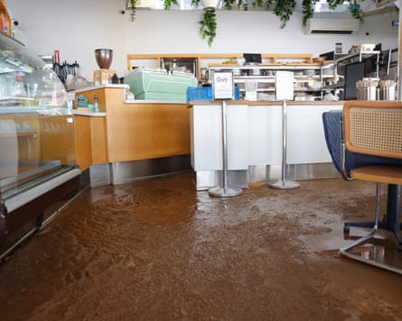 Damage from flood water on the floor of Dialog Cafe in West Hollywood.Photograph: Chelsea Lauren/Shutterstock