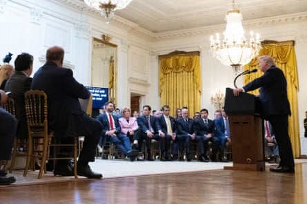 Trump addressing the nation as senior members of his administration look on.Photograph: Saul Loeb/UPI/Shutterstock