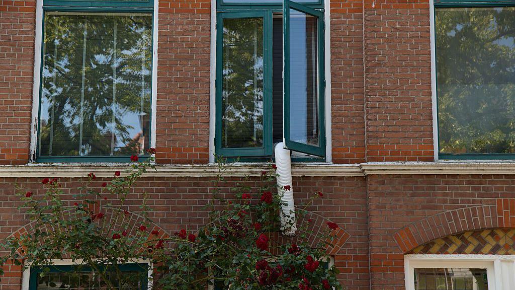 Image caption,Due to strict building regulations in Europe, many residents opt for portable air-conditioners without outdoor units