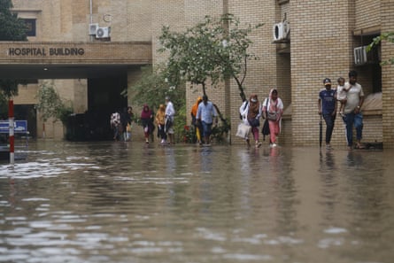 Flooding at a hospital in Dhaka, Bangladesh.Photograph: Rehman Asad/NurPhoto/Shutterstock