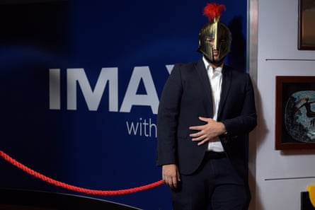 Walee Ahmed, a 26-year-old data, opts to wear a helmet to get the true Odyssey experience at the BFI Imax.Photograph: Christian Sinibaldi/The Guardian