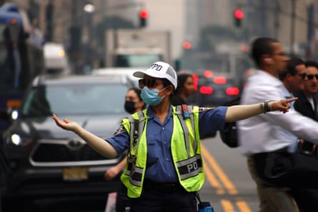 A policewoman directs traffic as air quality in New York City reached one of its worst levels in three years.Photograph: Deccio Serrano/NurPhoto/Shutterstock