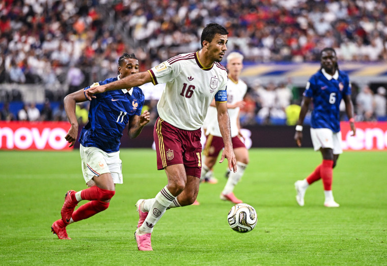 Rodri #16 of Spain controls the ball against Michael Olise #11 of France during the FIFA World Cup 2026 Semi Final match between France and Spain on Tuesday in Arlington, Texas.Hannah Peters / FIFA via Getty Images