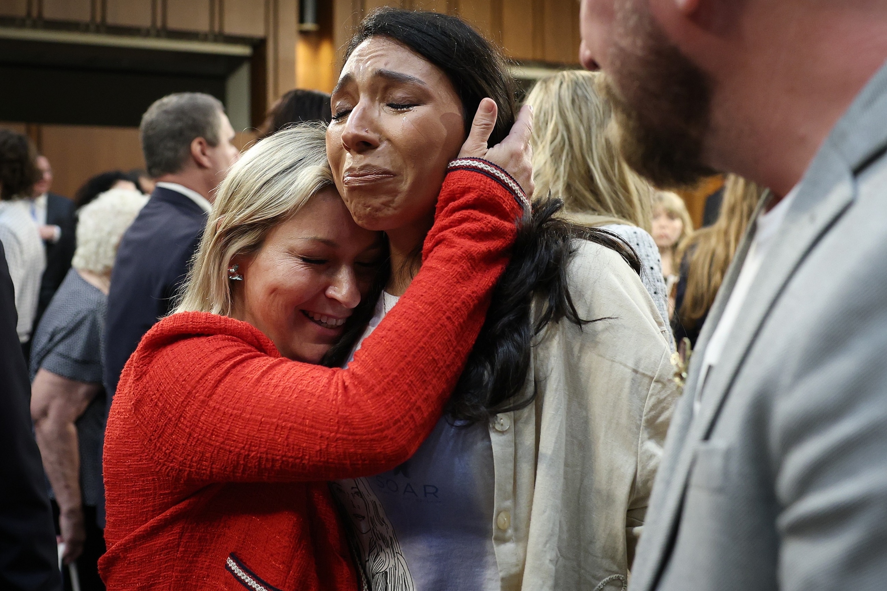 Epstein survivor Dani Bensky (L) embraces Amanda Roberts after Bensky finished testifying on Capitol Hill during the confirmation hearing for Todd Blanche as the Attorney General in front of the Senate Judiciary Committee July 16, 2026 in Washington.Win Mcnamee/Getty Images