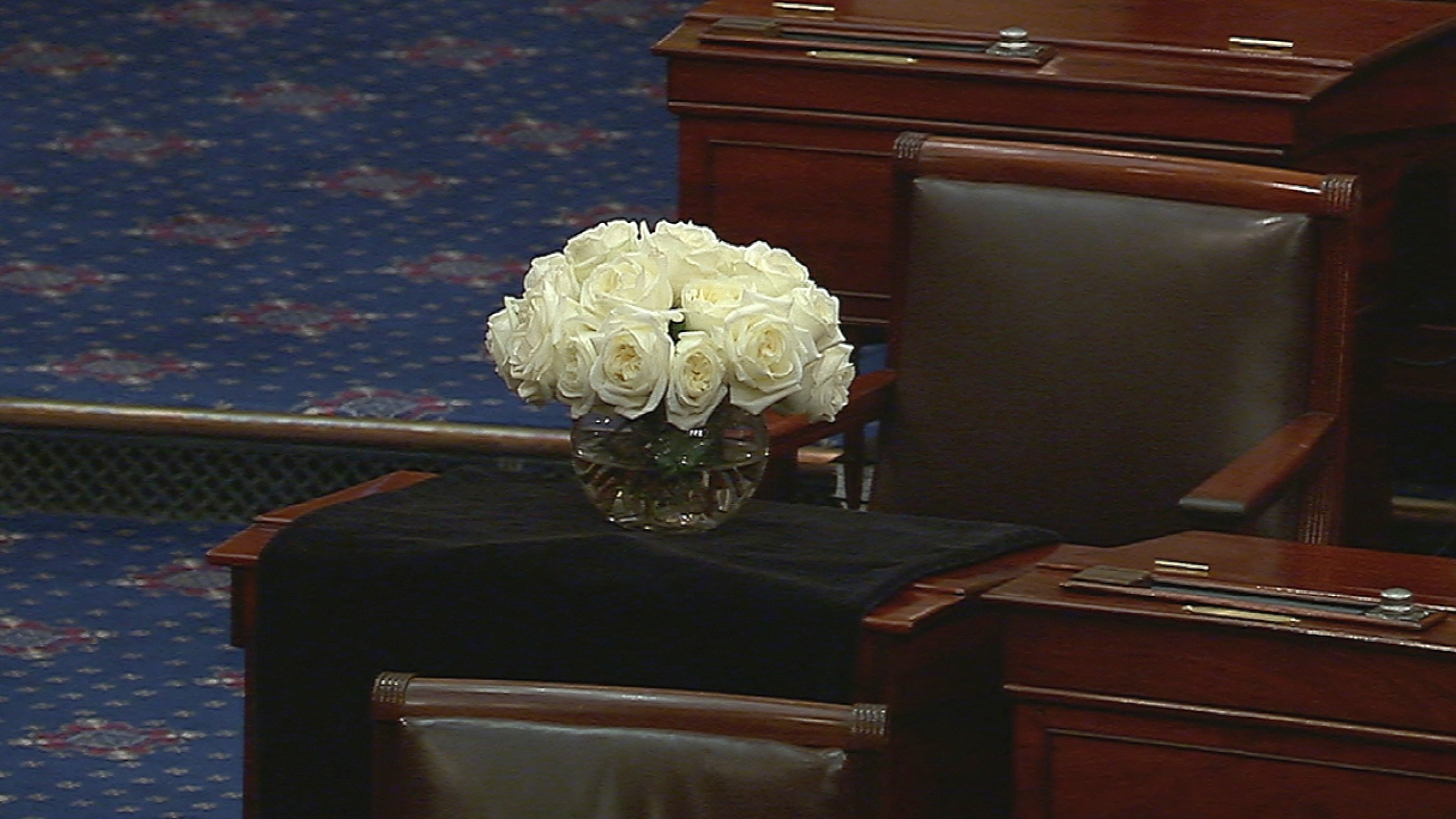 Sen. Lindsey Graham's desk in the Senate chamber is draped in a black shroud as the Senate gavels into session for the first time since his unexpected death this weekend, July 13, 2026 in Washington.Senate TV