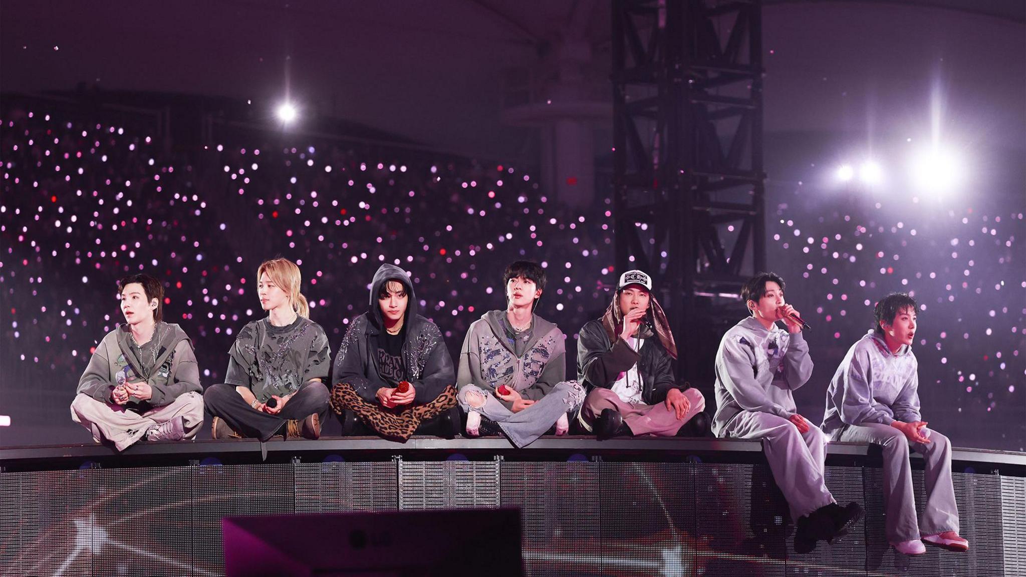 Image caption,BTS, pictured here at a recent concert, are part of coded everyday slang in North Korea, defectors say