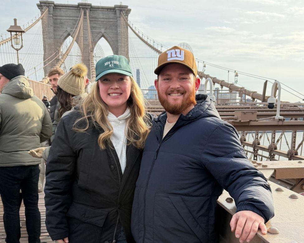Image caption,California-based Hannah, pictured with her husband, says the cost had initially deterred her from changing her name