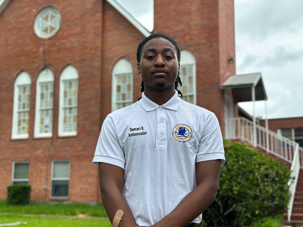 Image caption,De'Mari Benham believes the state is trying to curb black Alabamians voting rights. "This means a lot," he says.