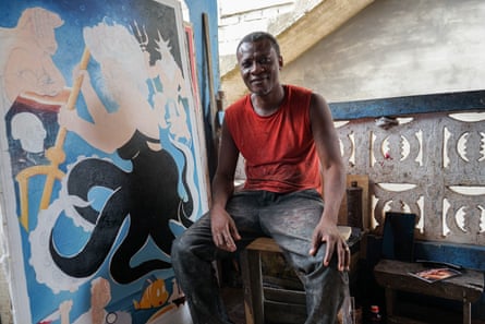 Jeaurs Affutu, popularly known as Heavy J, with his unfinished poster for The Little Mermaid.Photograph: Carlos Mureithi/The Guardian