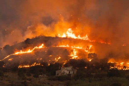 Flames and smoke rise from a wildfire near the municipality of El Pocico in Almería, Spain, earlier in July.Photograph: Pablo Blázquez Domínguez/Getty Images
