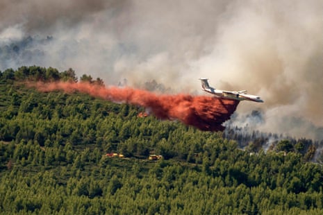 A fireguard aircraft from France’s civil security drops fire-retardant substance over a wildfire in Pouzols-Minervois, south-west France, in early July.Photograph: AFP/Getty Images