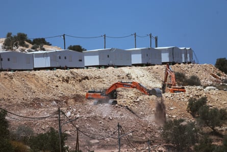 Israeli bulldozers prepare land for the construction of the new settlement of Dotan Valley near the West Bank city of Jenin.Photograph: Alaa Badarneh/EPA