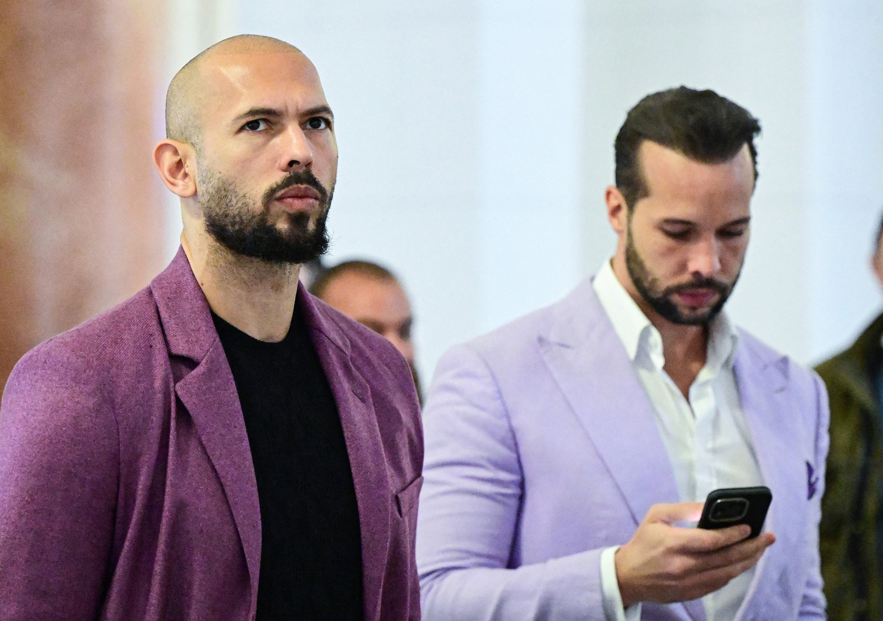 Andrew Tate (L) and his brother Tristan Tate are pictured inside The Court of Appeal in Bucharest, Romania, on December 10, 2024.Daniel Mihailescu/AFP via Getty Images