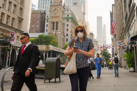Pedestrians walk in Manhattan during an air quality health advisory due to wildfire smoke, in New York.Photograph: Ryan Murphy/AP