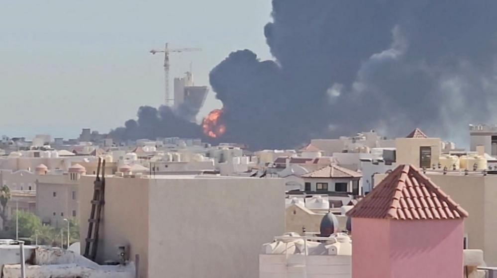 Image caption,Smoke billowed near an oil facility in Mangaf, Kuwait on Saturday after Iranian strikes