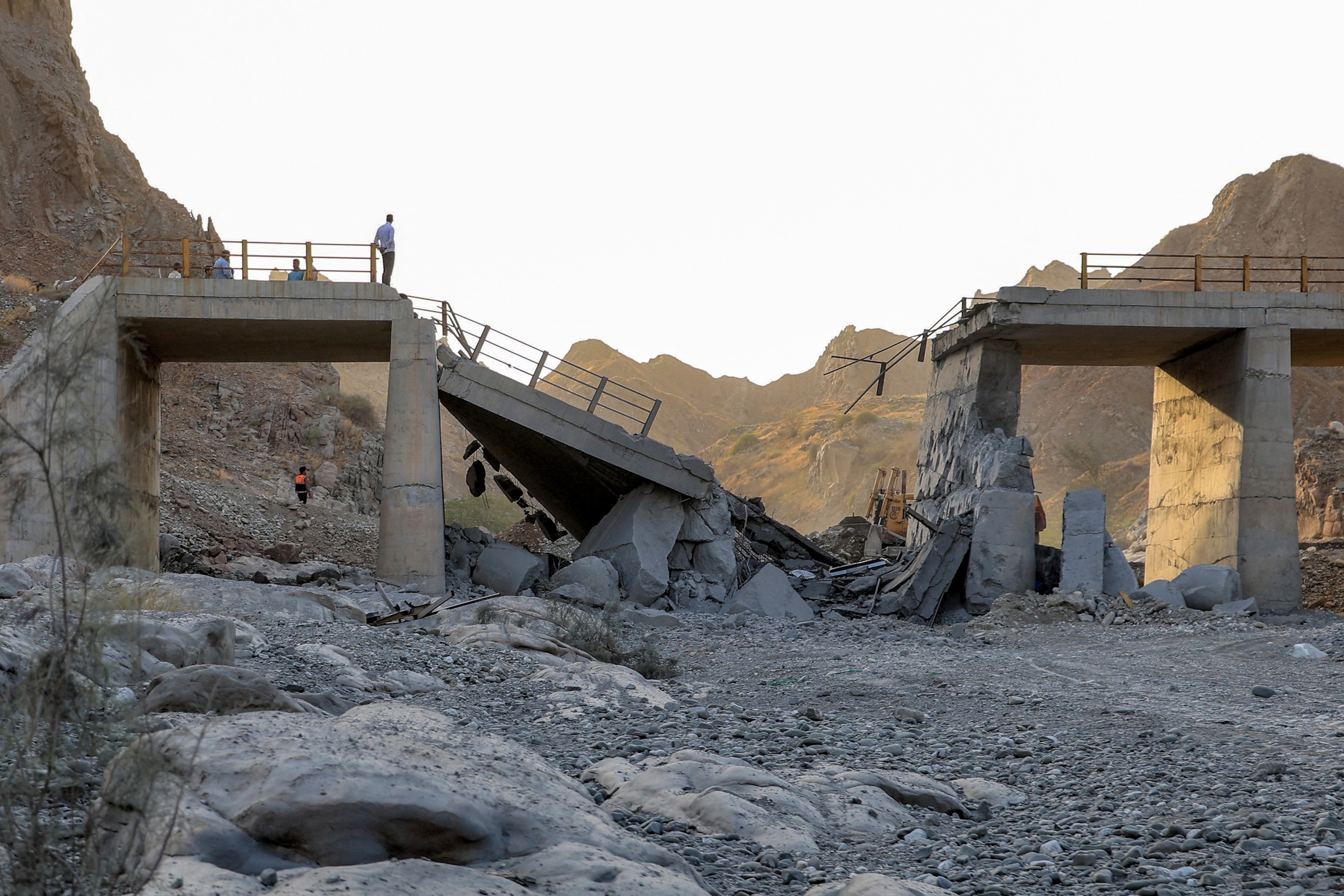 A heavily damaged bridge which was hit by a U.S. strike is pictured along the road connecting Roudan and Bandar Abbas in southern Iran on July 18, 2026.Amir Hossein Khorgooei/ISNA/AFP via Getty Images