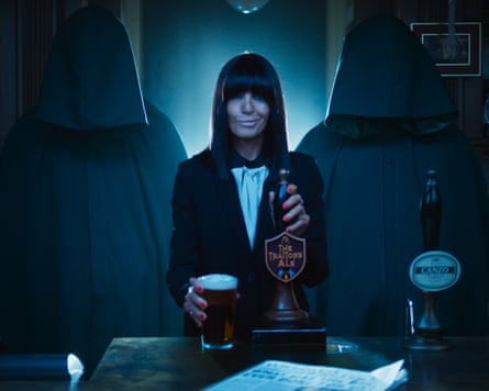 Claudia Winkleman pulls a pint of The Traitor’s Ale.Photograph: BBC