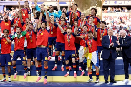 Rodri lifts the World Cup Trophy alongside Donald Trump and Gianni Infantino.Photograph: Carl Recine/Getty Images
