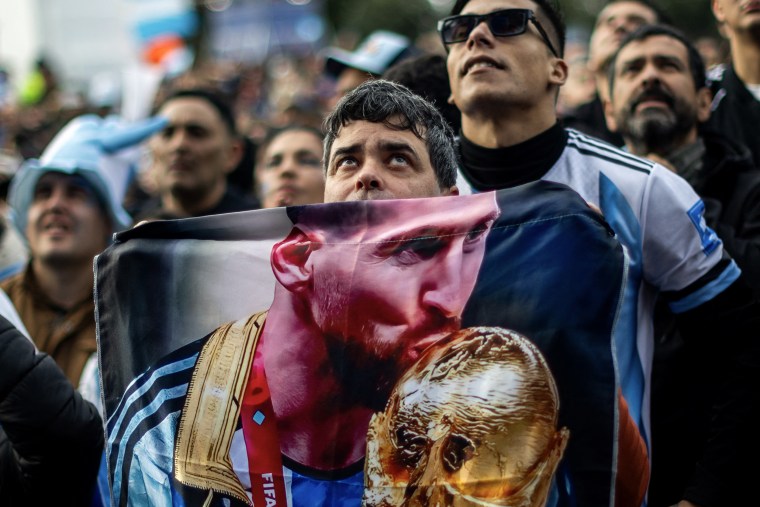 A Lionel Messi fan watching the final match between Spain and Argentina on a giant screen in Buenos Aires.Tomas Cuesta / AFP via Getty Images