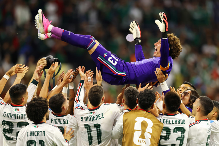 Teammates toss Guillermo Ochoa of Mexico into the air following their victory against Czech Republic in Mexico City.Molly Darlington / Getty Images