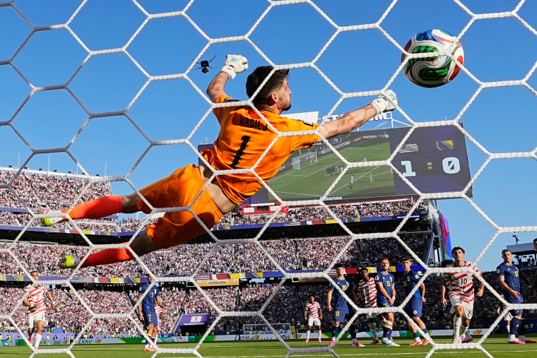 Malik Tillman of the U.S. scores their second goal against Bosnia from a free kick.Martin Meissner / AP