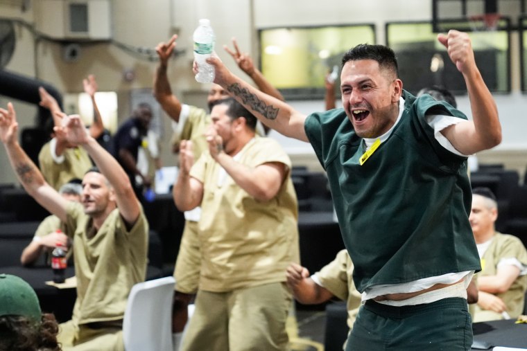 Argentina fan Victor Caldas watches the semifinal match between England and Argentina with fellow Rikers Island inmates at the jail complex in New York.Seth Wenig / AP