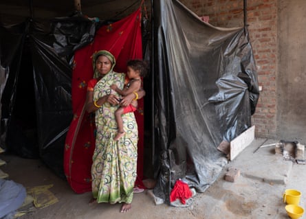 Inder and Laxmi Kumar. ‘We kept working because if we stopped, we wouldn’t be paid,’ said Laxmi.Photograph: Smita Sharma/The Guardian