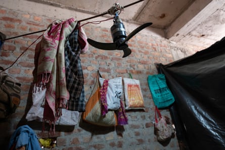 The makeshift tent where Kumkumari, 35, lives with her family is built of plastic with no ventilation, it relies on a small temporary fan for cooling.Photograph: Smita Sharma/The Guardian