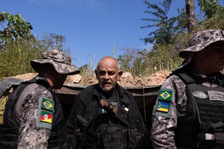 Security forces find an underground bunker in Vila Cururu.Photograph: João Laet/The Guardian